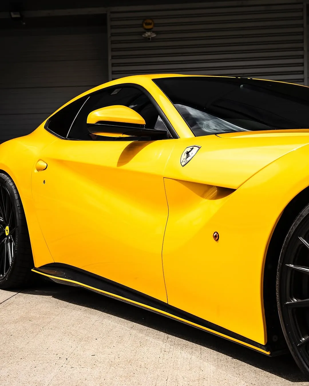 Ferrari F12 wrapped in Inozetek Gloss Dandelion Yellow Dynamic PPF View 2