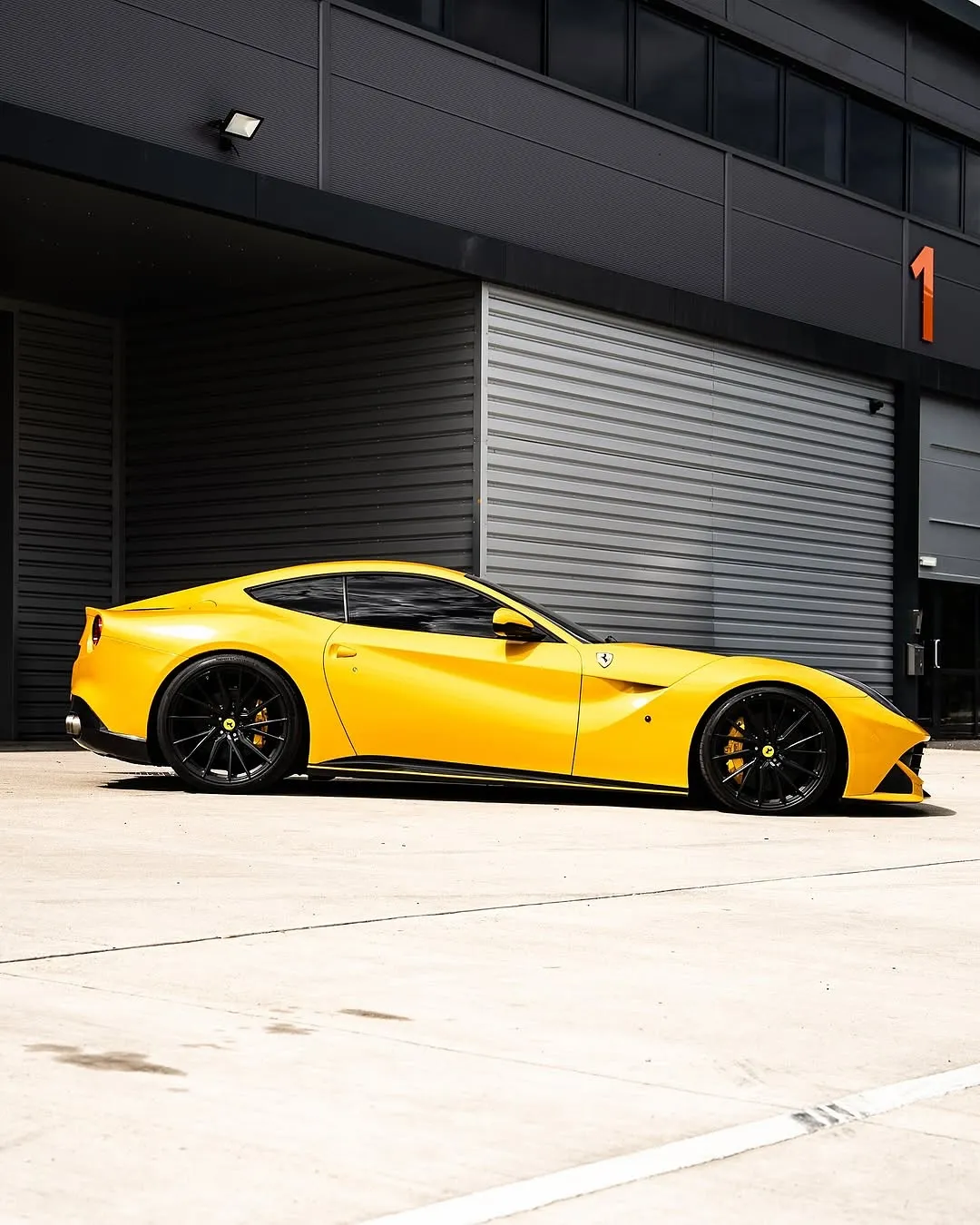 Ferrari F12 wrapped in Inozetek Gloss Dandelion Yellow Dynamic PPF View 1