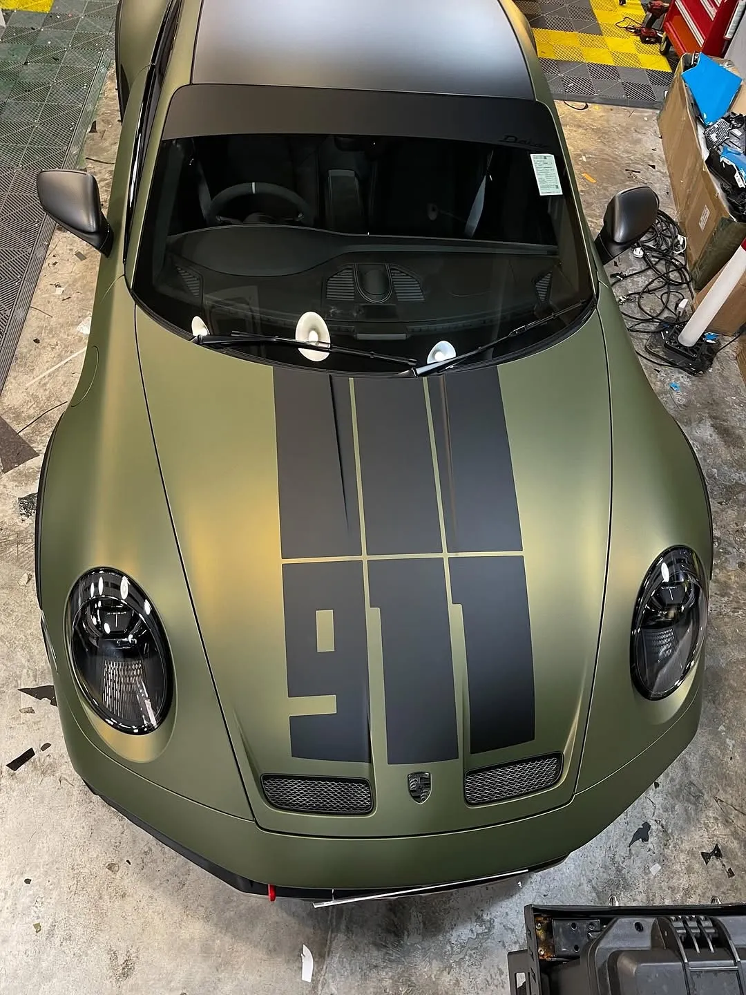Porsche 992 Dakar wrapped in Inozetek Dynamic PPF, featuring Frozen Metallic Titanium Green, Satin Blackout, Dry Carbon Fiber, and Gloss Italia Red. - изображение 6