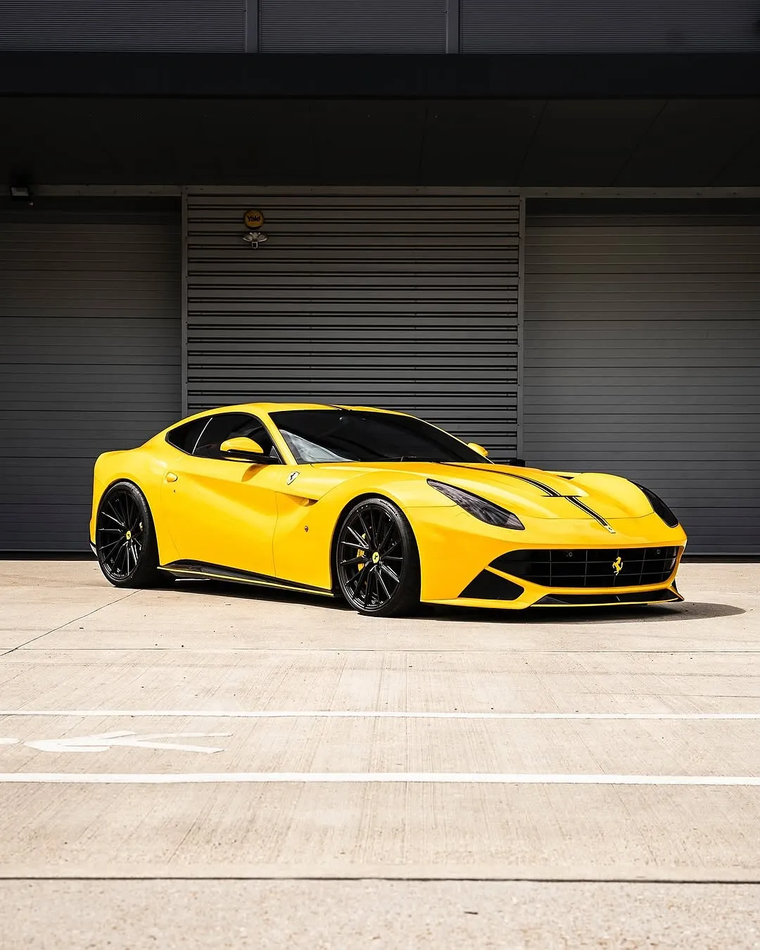 Ferrari F12 wrapped in Inozetek Gloss Dandelion Yellow Dynamic PPF